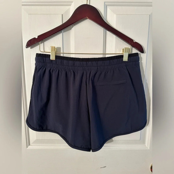 EUC ATHLETA COLOR BLOCKED SHORT Navy Black Size 8 Zip Pocket Running Athletic - Picture 3 of 10